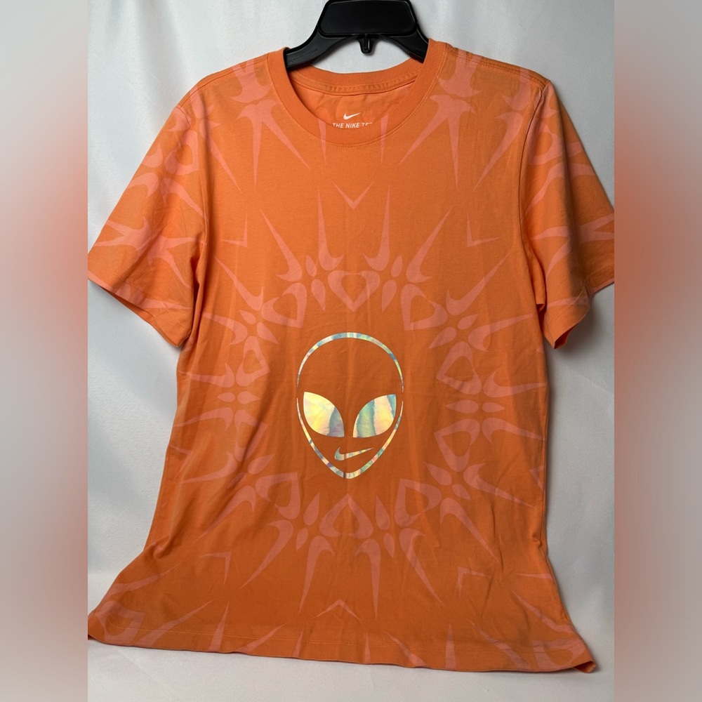 The Nike tee orange/pink in color. NWOT size small men’s